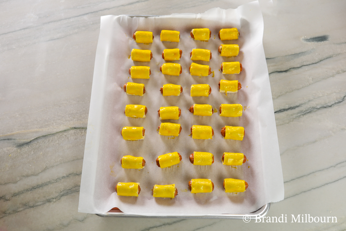 Brush each pastry all the way around with the remaining egg yolk. However, you can simply brush pastry tops, if you desire. 