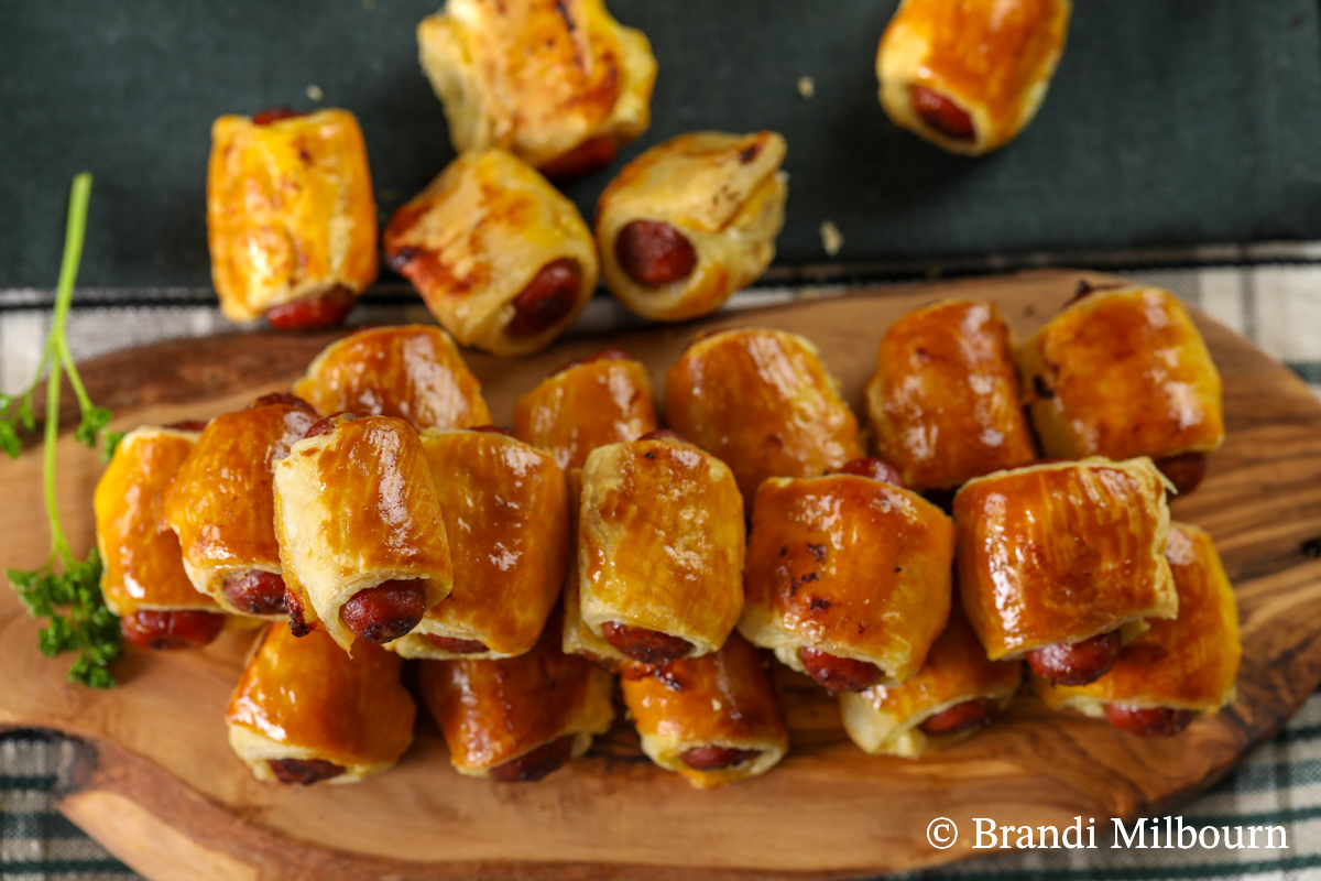 Baked pigs on a blanket piled high ready for crowds, including your Super Bowl party.