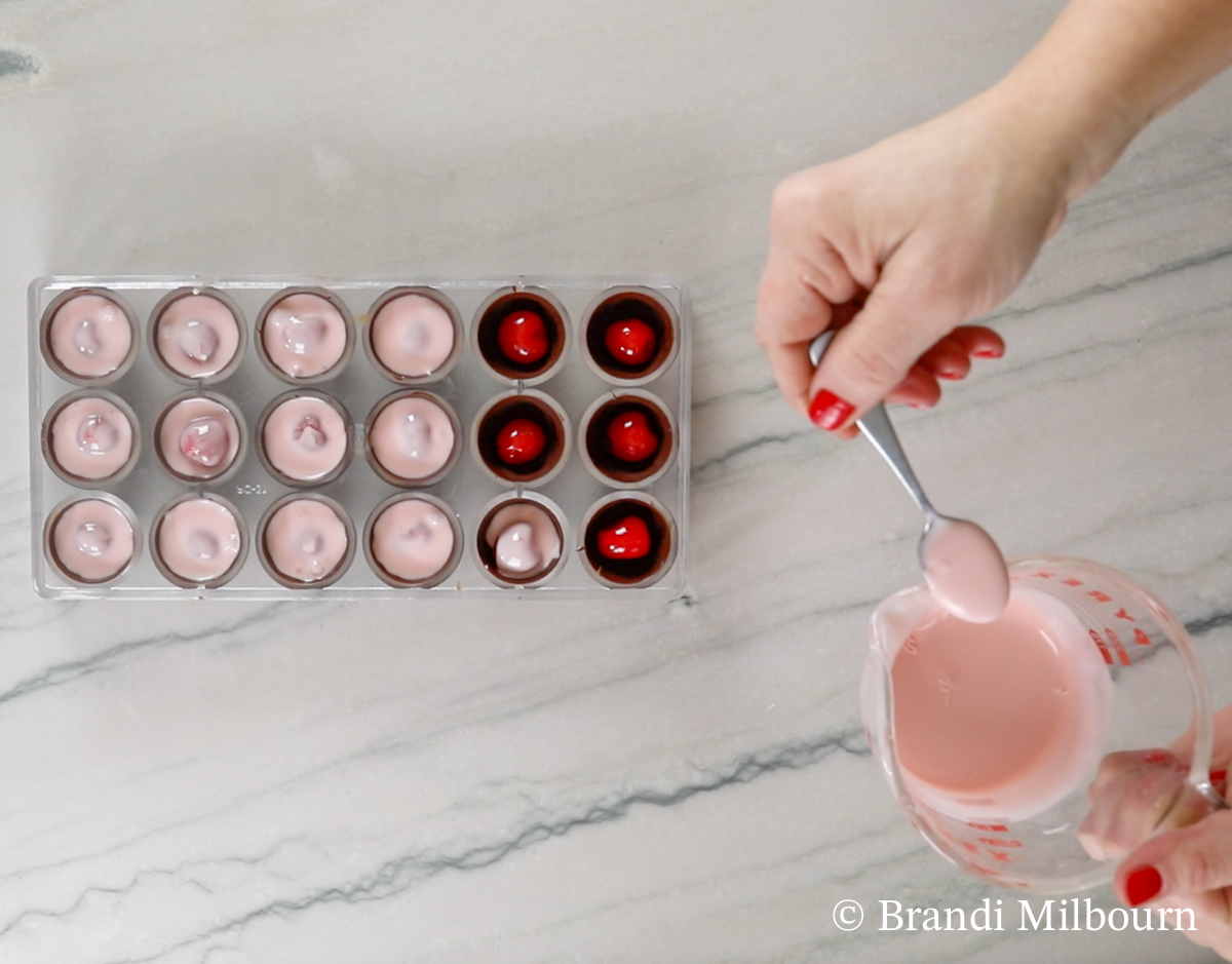 Next, fill with liquid fondant ¾ full. 

Leave space at the top for chocolate to seal fondant completely. 

Place in freezer for 10 minutes.