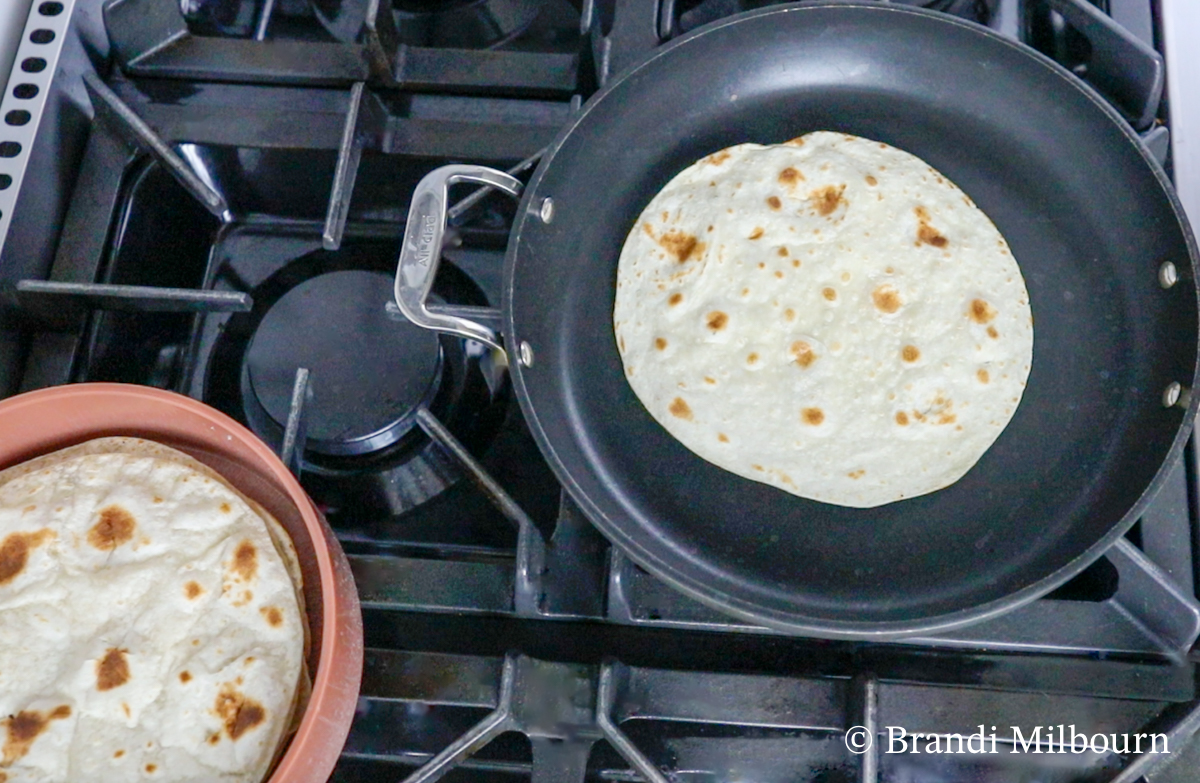 Tortilla Land tortillas need to be cooked however you can choose regular flour tortillas that do not need to be cooked before filling. Instructions for cooking tortillas: In another skillet over medium heat, cook each tortilla for 1 minute each side and place in a tortilla warmer (optional).