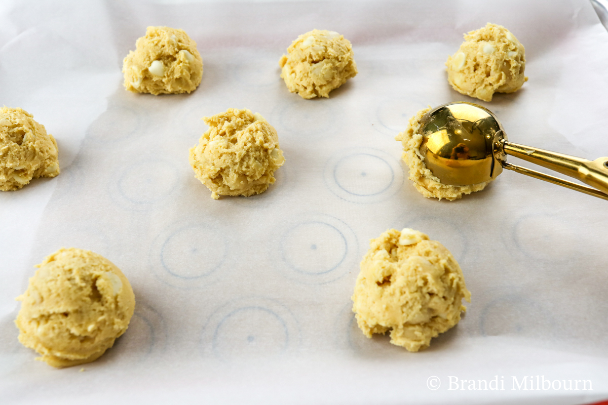 Using a medium cookie scoop (#40, 1.7 oz), scoop dough on prepared cookie sheet approximately 2 inches apart.