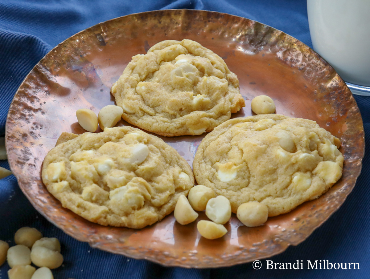 plate of three white chocolate macadamia nut cookies