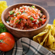 Authentic bowl of pico de gallo with a side serving of chips