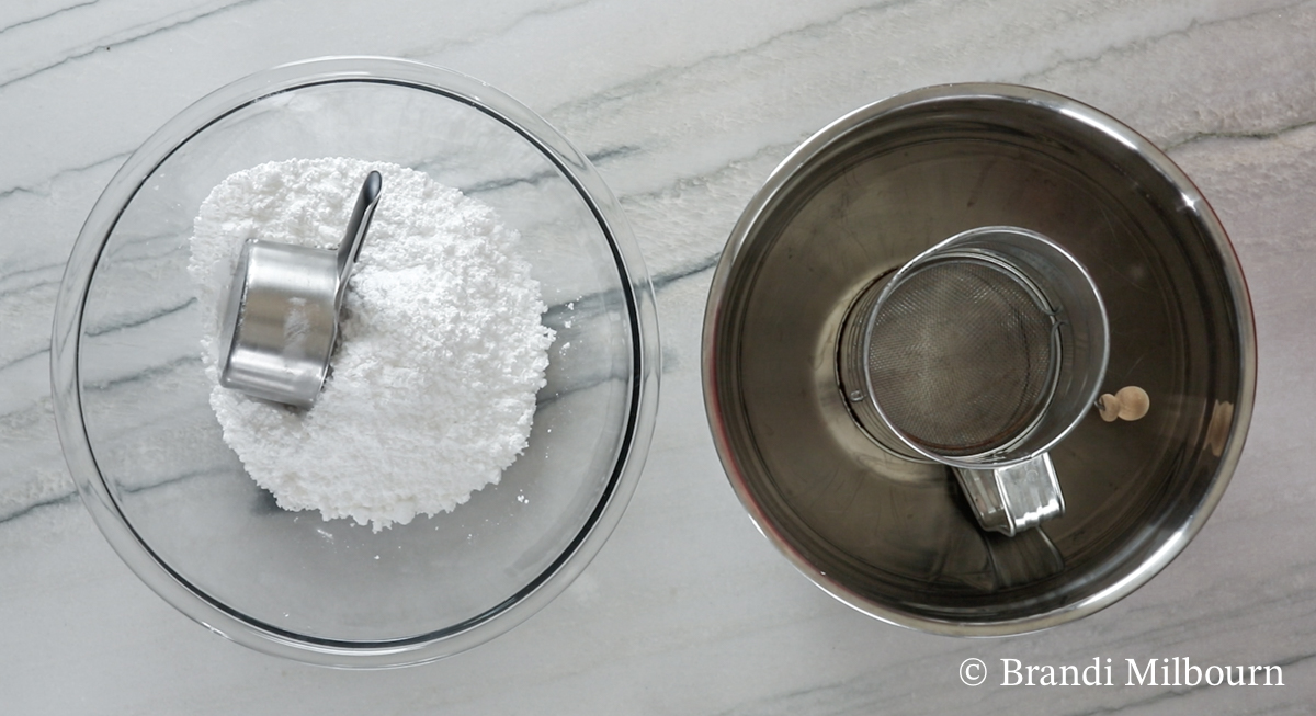 Sifting powder sugar for chocolate covered cherries