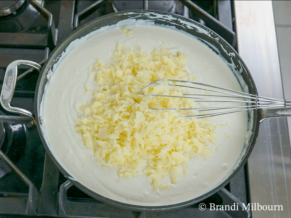 Add 2 ½ cups of Monterey jack cheese and stir until melted and combined. Then remove from heat.