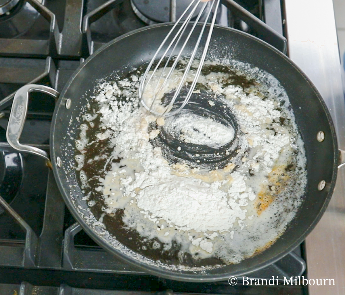 In a separate skillet, over medium heat, melt butter. Whisk in flour constantly for about 1 minute. 