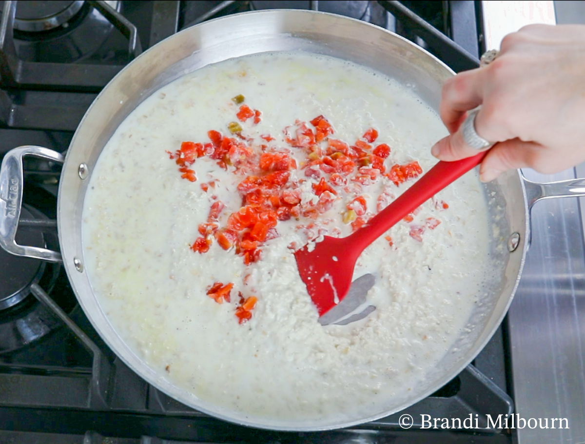 Next, add ½ cup Monterey and Rotel tomatoes (if using). Cook until liquid is half the amount, about 12 minutes.