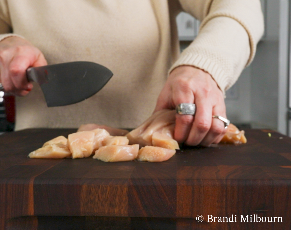 Cut chicken into chunks for white chicken chili recipe