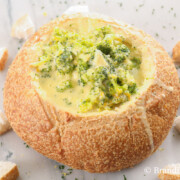 bowl of broccoli cheese soup in a bread bowl that is better than Panera