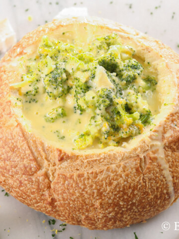 bowl of broccoli cheese soup in a bread bowl that is better than Panera
