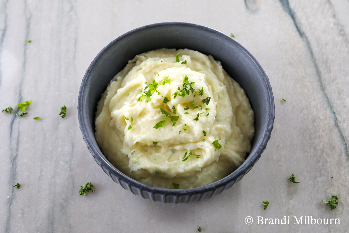 Bowl full of White cheddar mashed potatoes