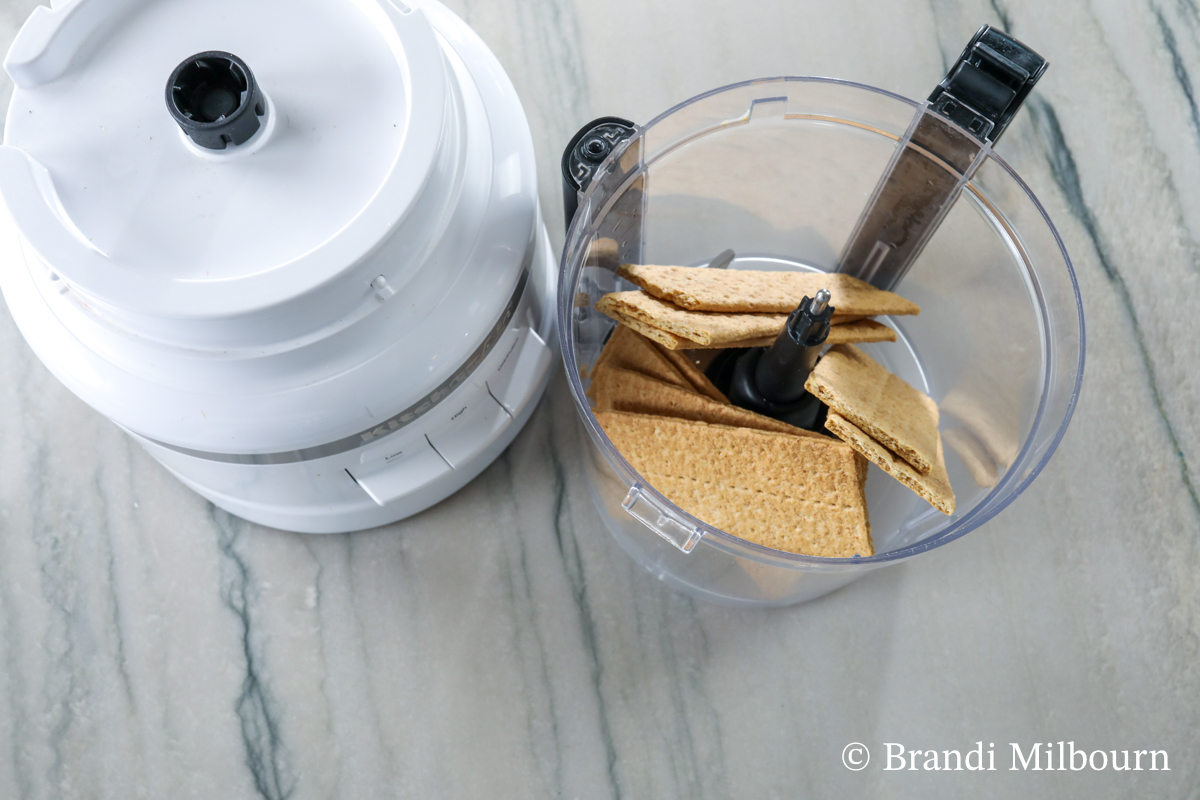 Use a food processor to turn graham crackers into crumbs