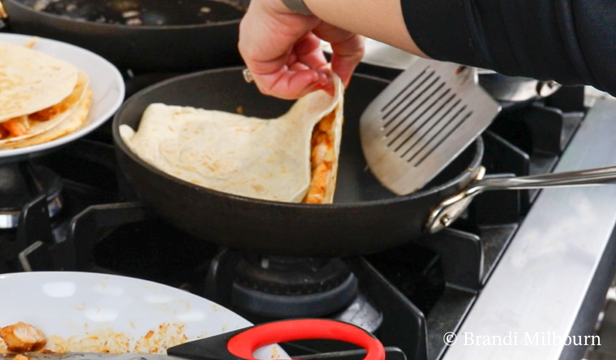 Turn quesadilla with wide turner